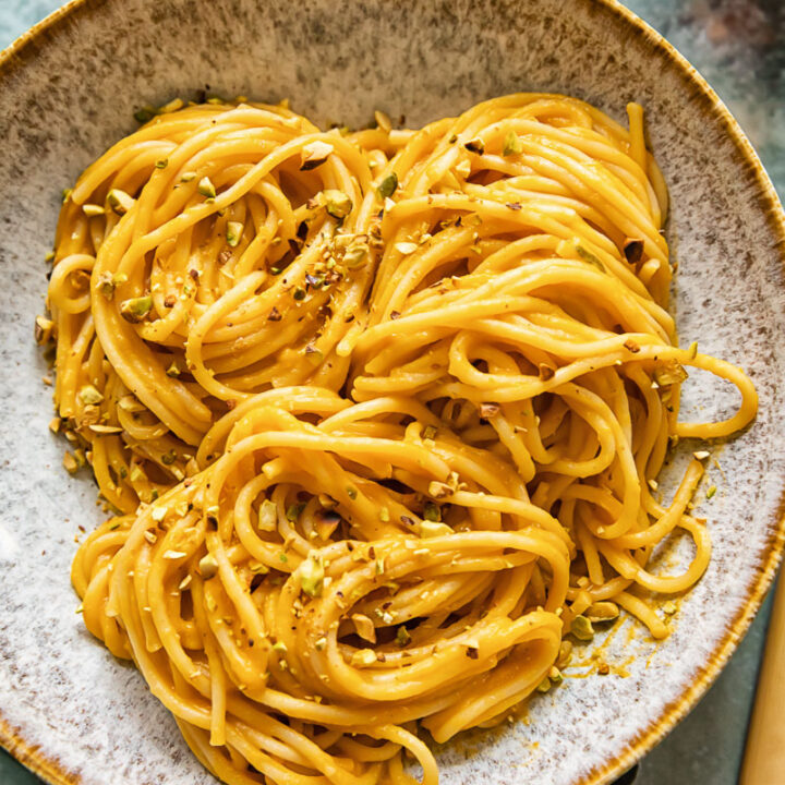 Bowl of roasted butternut squash pasta with pistachio crumb