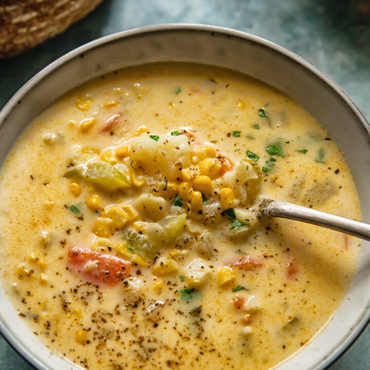 bowl of corn chowder with a spoon